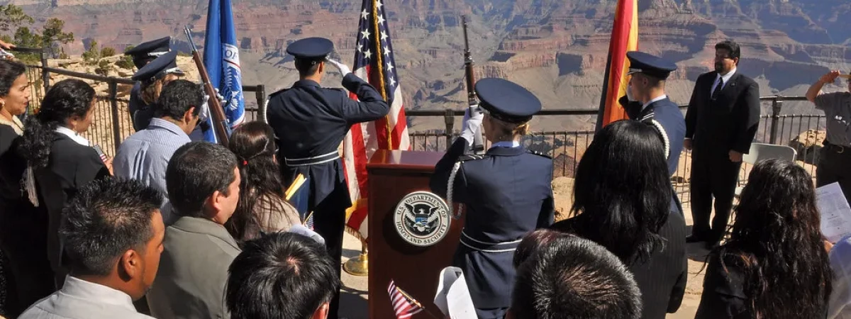 New U.S. citizen taking the oath of allegiance at a naturalization ceremony — Florida Board Certified Immigration Law Center